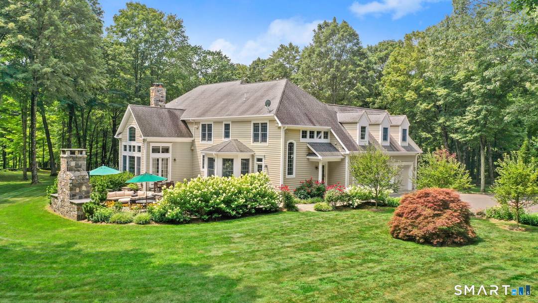 Nestled on three picturesque acres and surrounded by open space, this beautiful country retreat offers privacy, comfort, and exceptional outdoor living.
