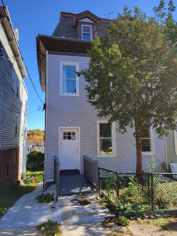 This is a well maintained 2 family house, that features a duplex apartment, that occupies the 1st floor and the basement.