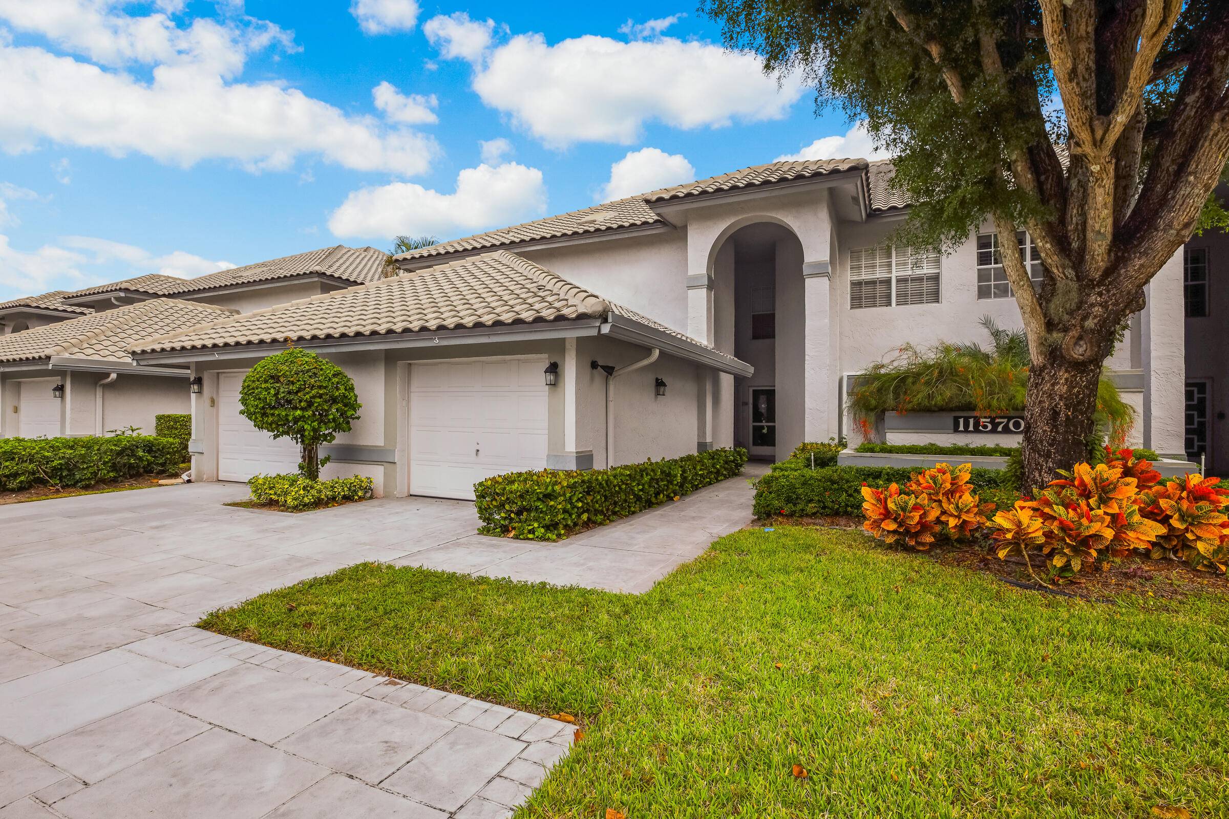 STEP INTO THIS 2 2 1 CG 1ST FLOOR CONDO, YOU'LL LOVE THE TREMENDOUS SIZE OF THE GREAT ROOM THAT LOOKS OUT TO A PANORAMIC VIEW OF LUSH GREENERY TREES.