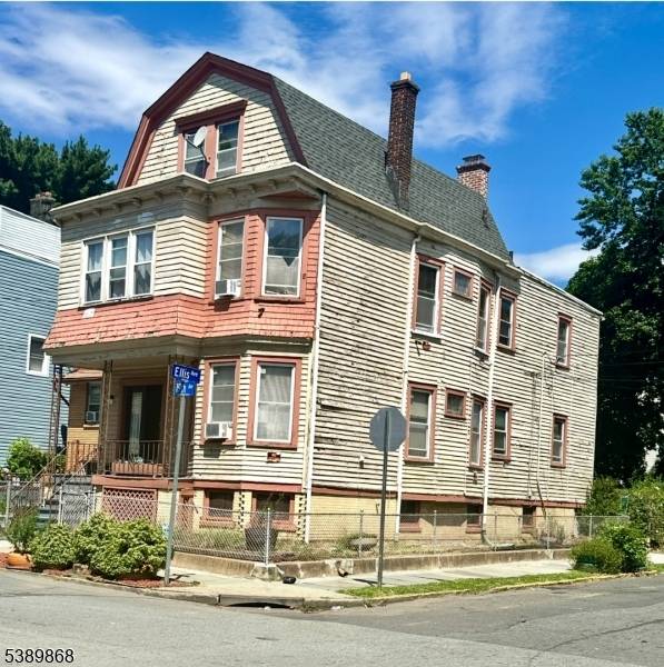 This spacious 3 story, two family home with a second floor enclosed porch and a third floor suite offers incredible potential.