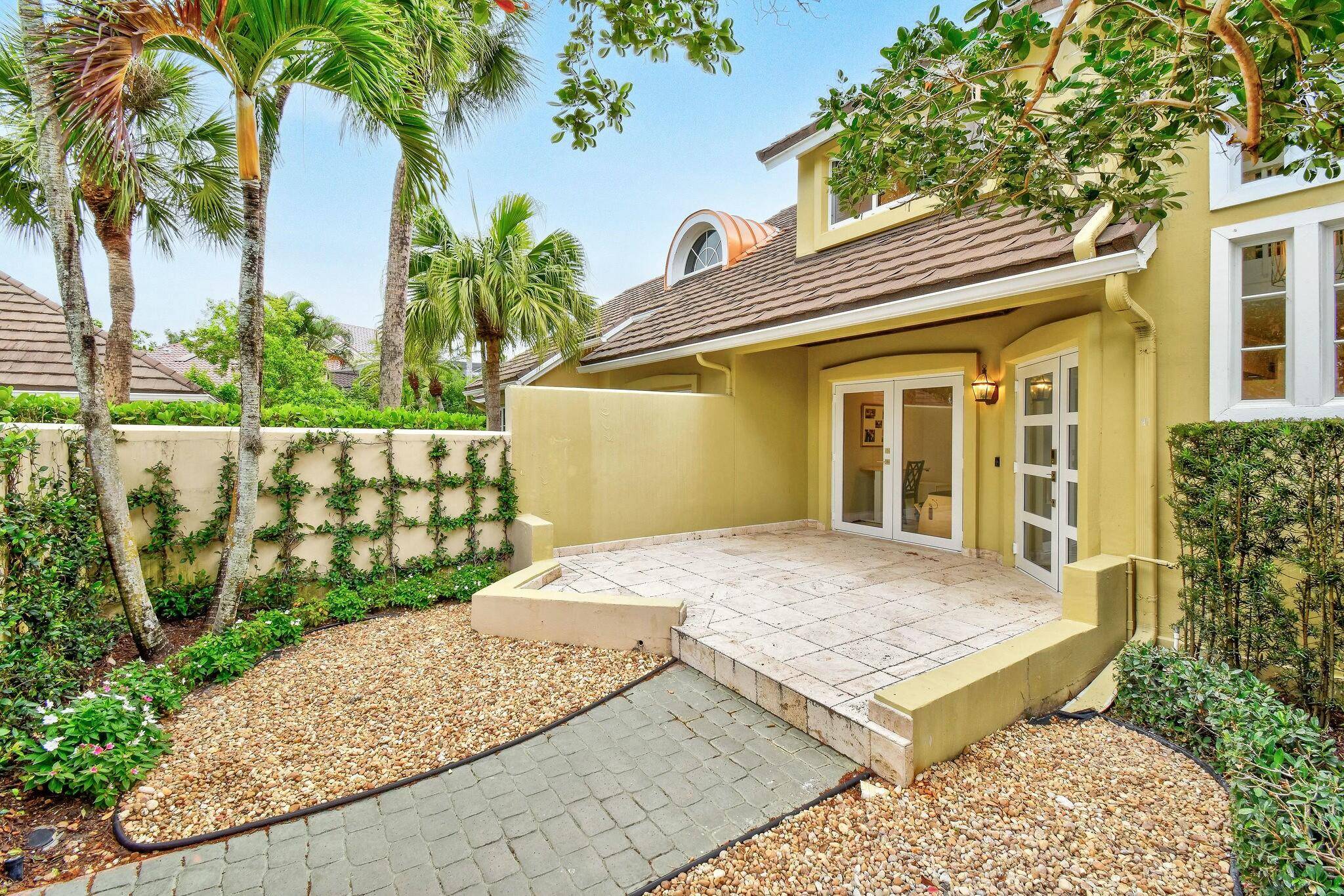 Nestled in the prestigious Palm Beach Polo Club, this beautifully updated townhouse offers breathtaking lake views and an exceptional blend of comfort and style.