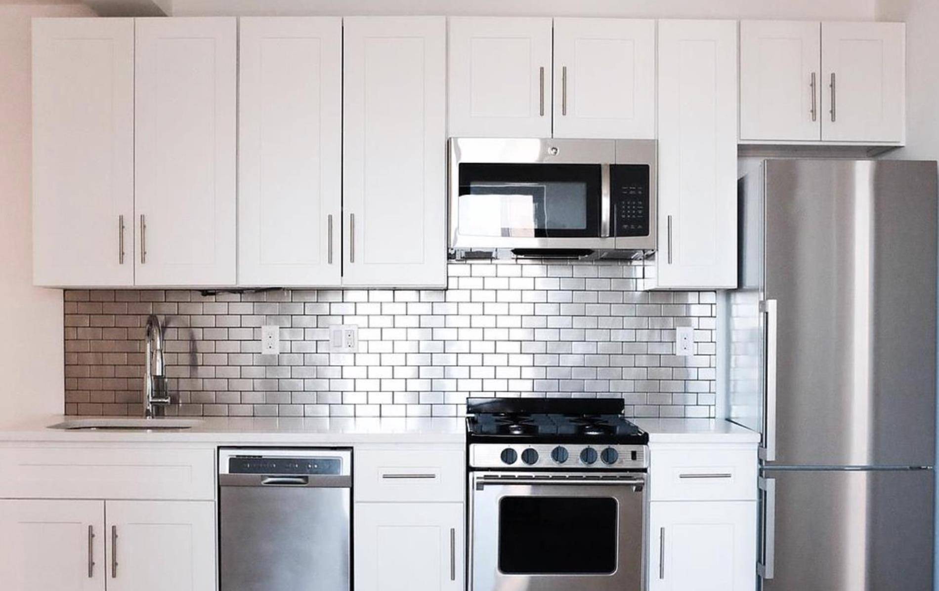 MUST 4 BEDROOM DUPLEX ! in unit washer and dryer stainless steel appliances custom cabinetry dishwasher microwave stone countertopsPrime South Park Slope apartment featuring bleached plank floors, custom lacquer white ...