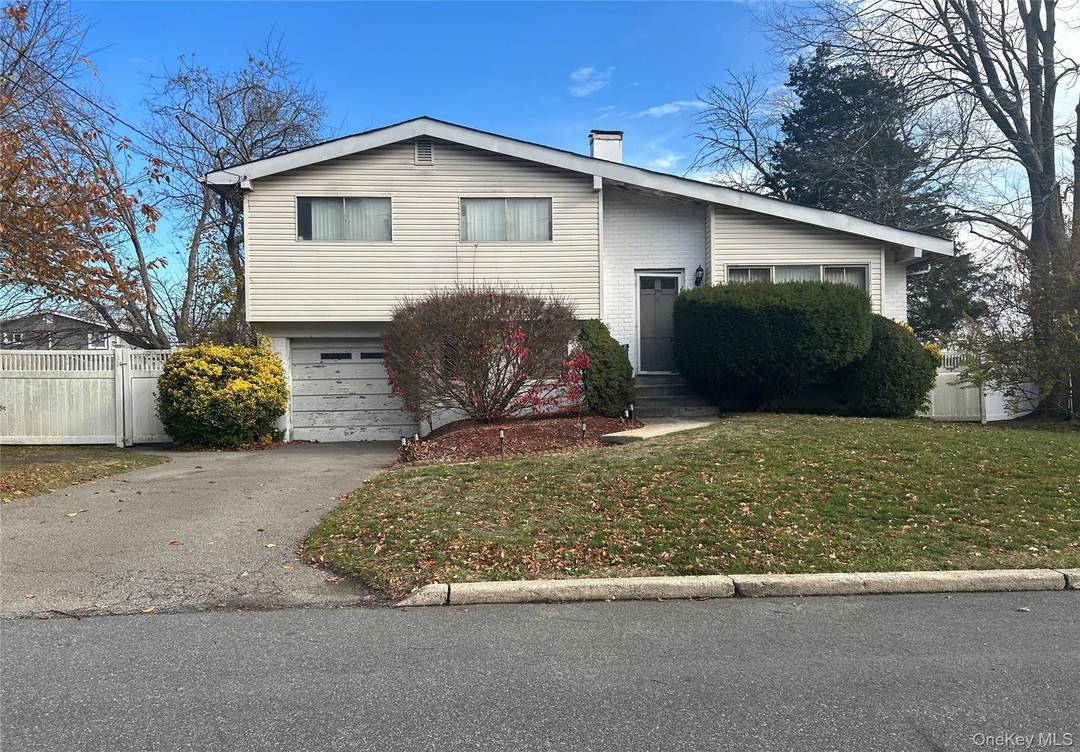 This Split Level Style Home Features 4 Bedrooms, 2.