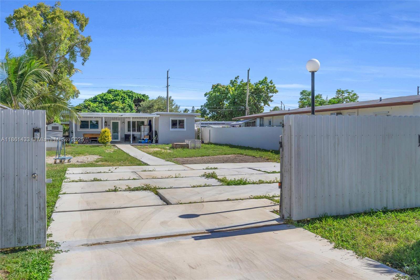 Charming 3 2 Home with a Huge front Yard, New ROOF 2024, Impact Windows installed 2019, and A C 2019, The property yard is perfect for outdoor activities, entertaining or ...
