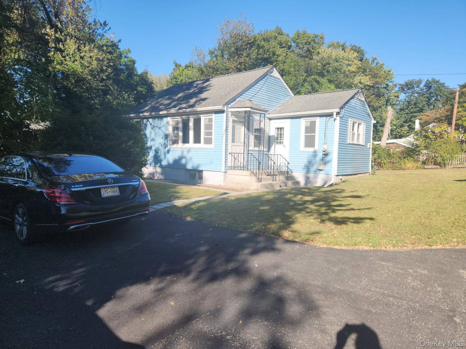 3 or possible 4 bedroom with 2 full baths, recently installed carpets, painting, new bathroom, vanity, driveway, refrigerator, and propane heating hot water boiler.