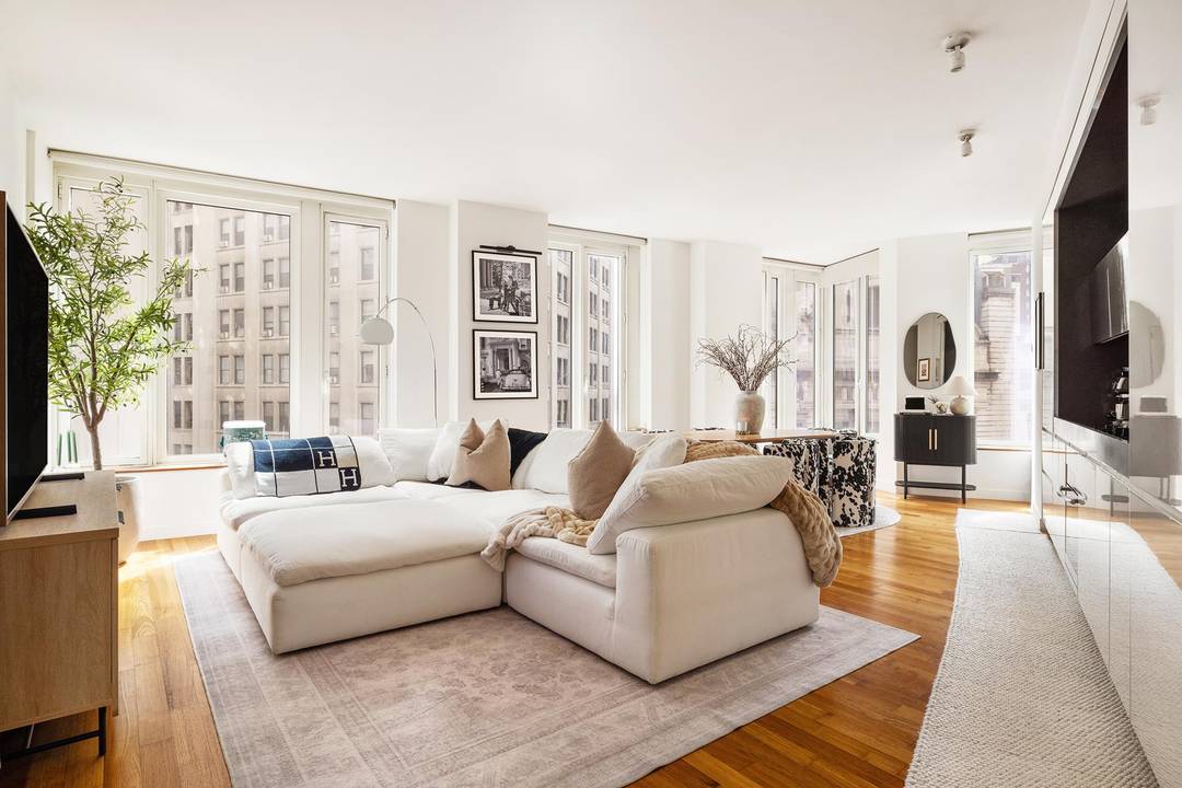 Residence 14E at 15 William Street is a spacious and light filled two bedroom, two bath home in one of Downtown Manhattan s premier full service condominiums.