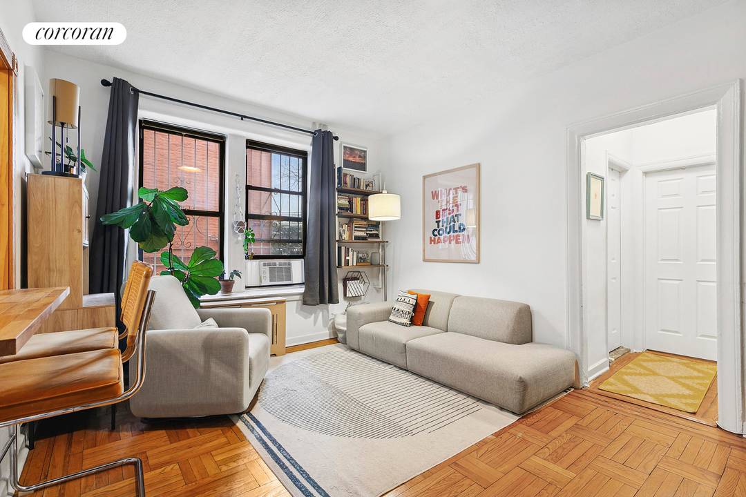 Bright southern exposure defines this peaceful second floor co op apartment, which overlooks a lush New York green space at the rear of the building.