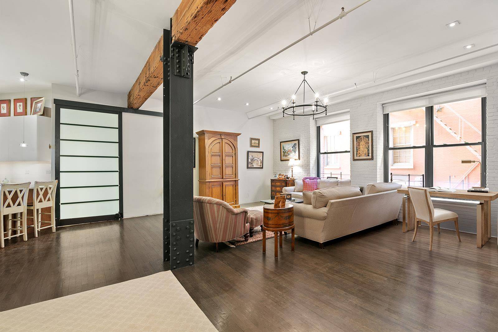 Rarely available 1550 SF two bedroom, two full bath authentic loft features a wonderful layout and an abundance of Prewar charm, character, and classic architectural details !