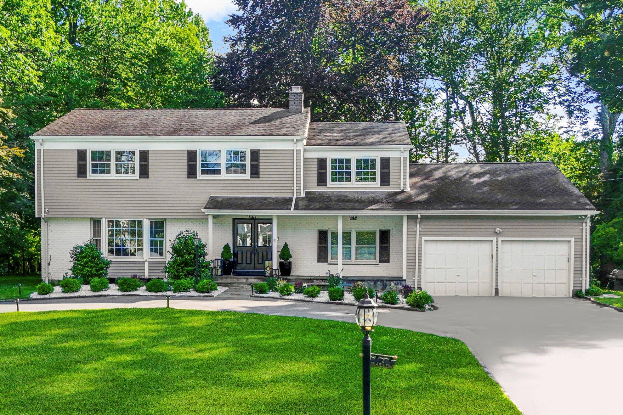 Enjoy the natural beauty and partial water views of the Long Island Sound in this wonderful Colonial home located on a quiet cul de sac in the desirable Greenhaven neighborhood ...