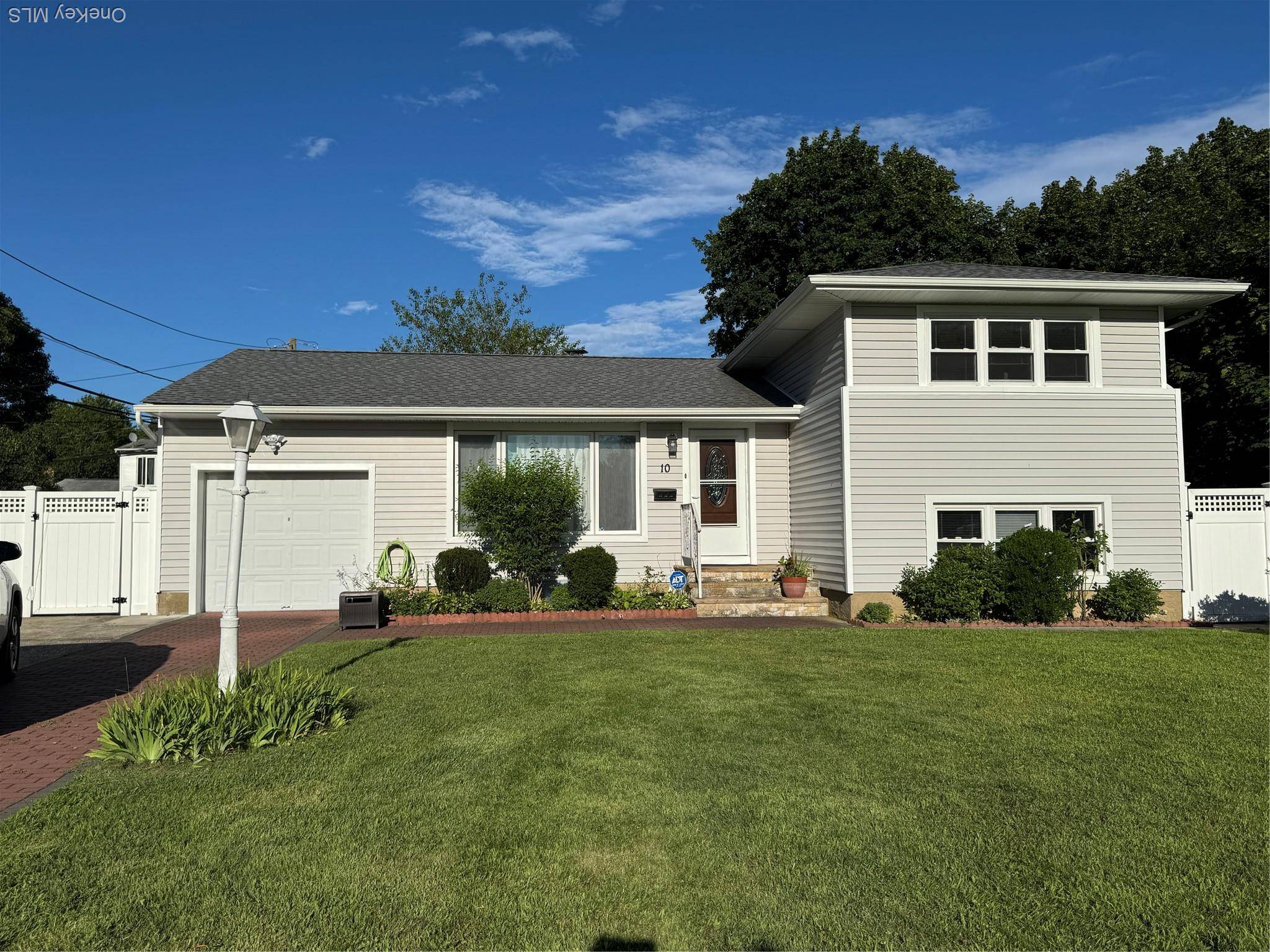 Welcome to this beautifully maintained split level home !