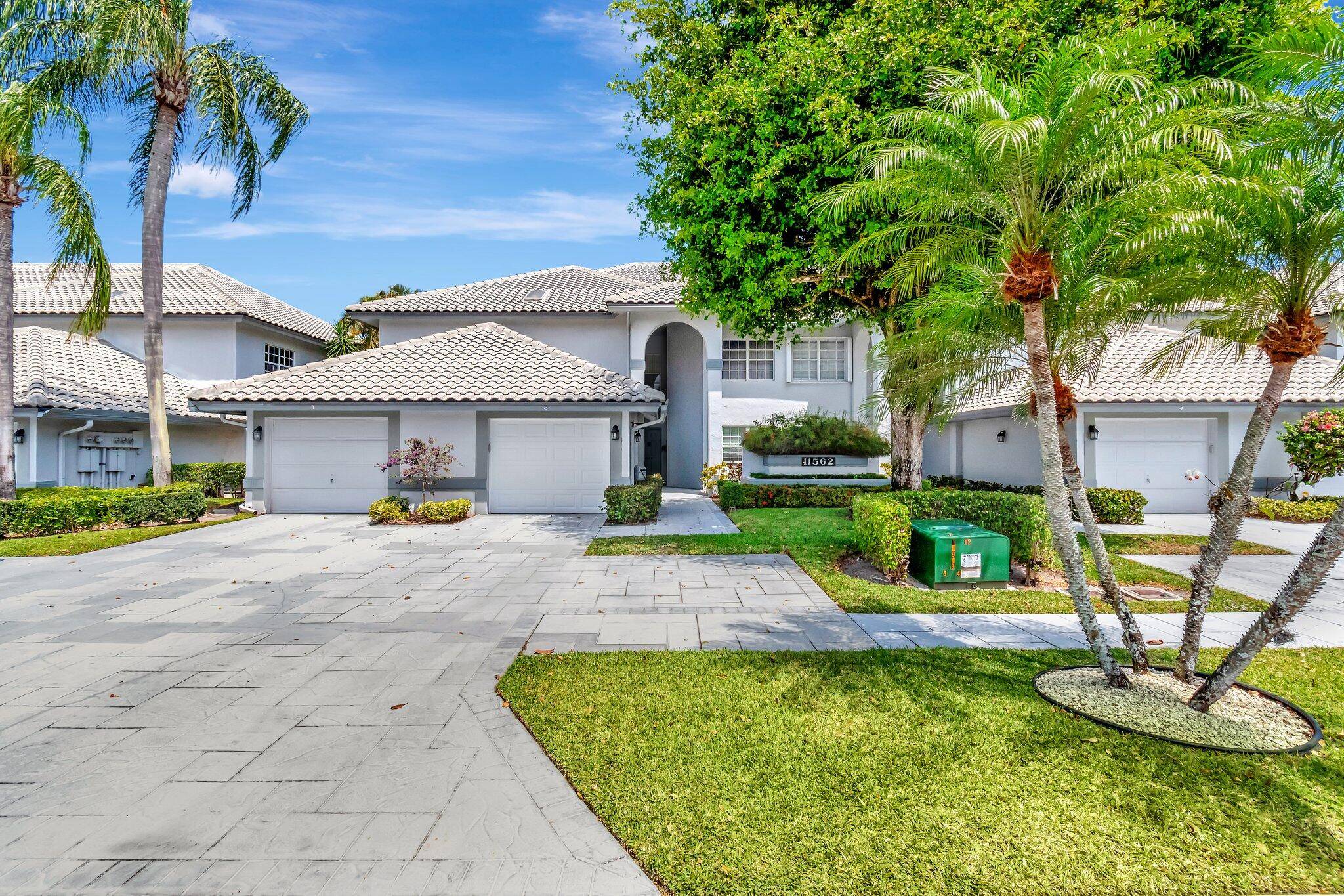 Spacious 1st floor coach home with a golf course view and 1 car garage.