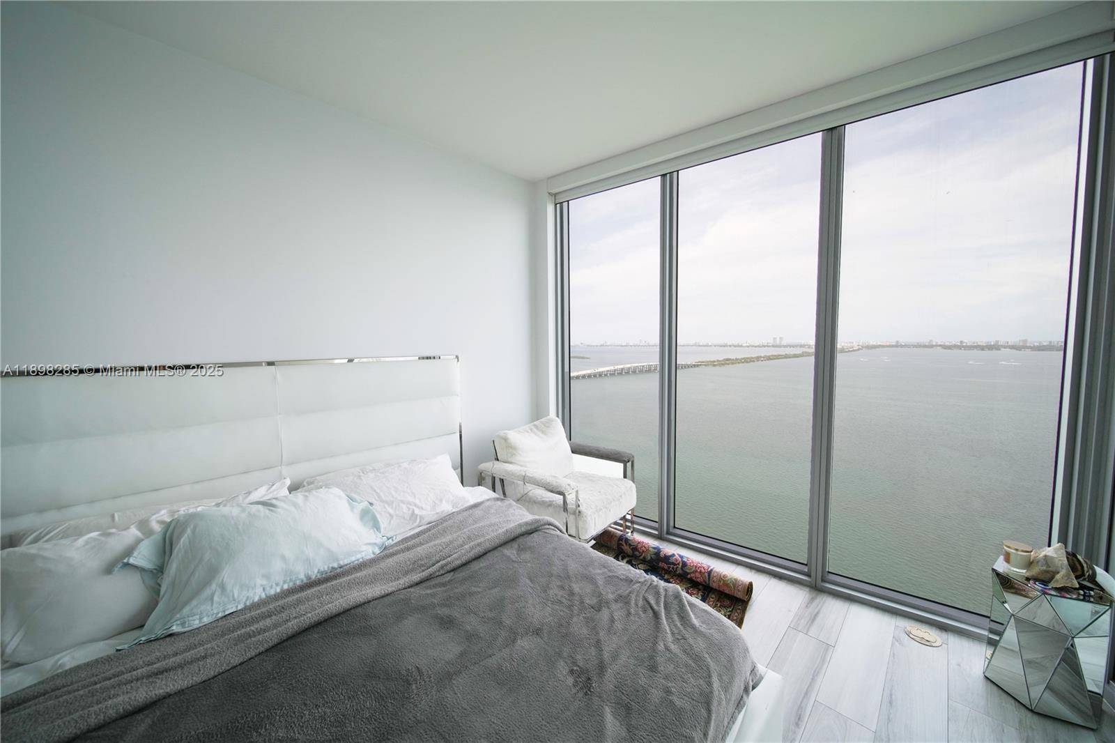 Stunning 2BD DEN 3BA residence at Biscayne Beach with private elevator entry and bay views from both bedrooms and the living room.