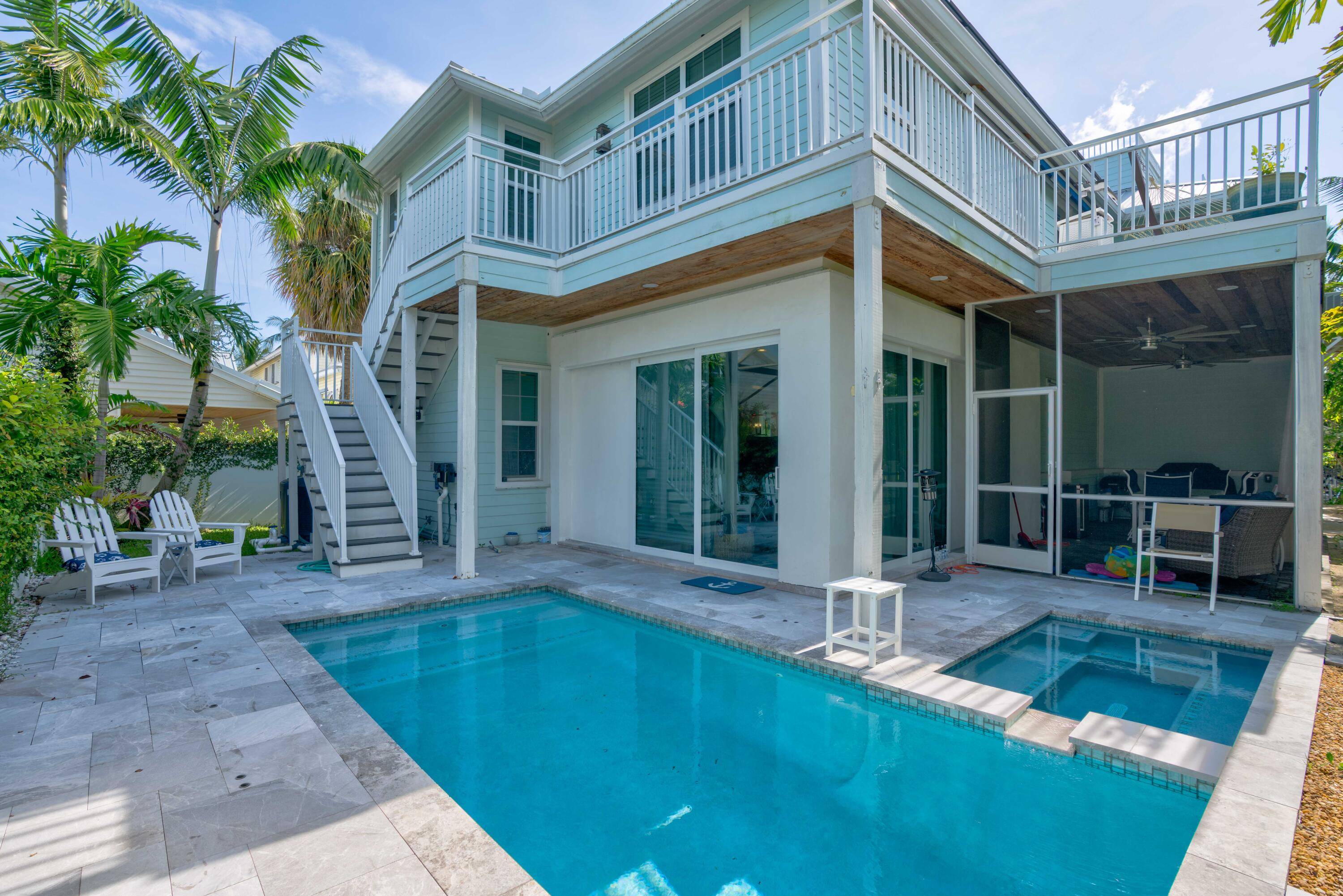 Fully renovated, furnished concrete home with impact windows, just a 5 min walk to dog friendly Carlin Park Beach with shower access across the community.