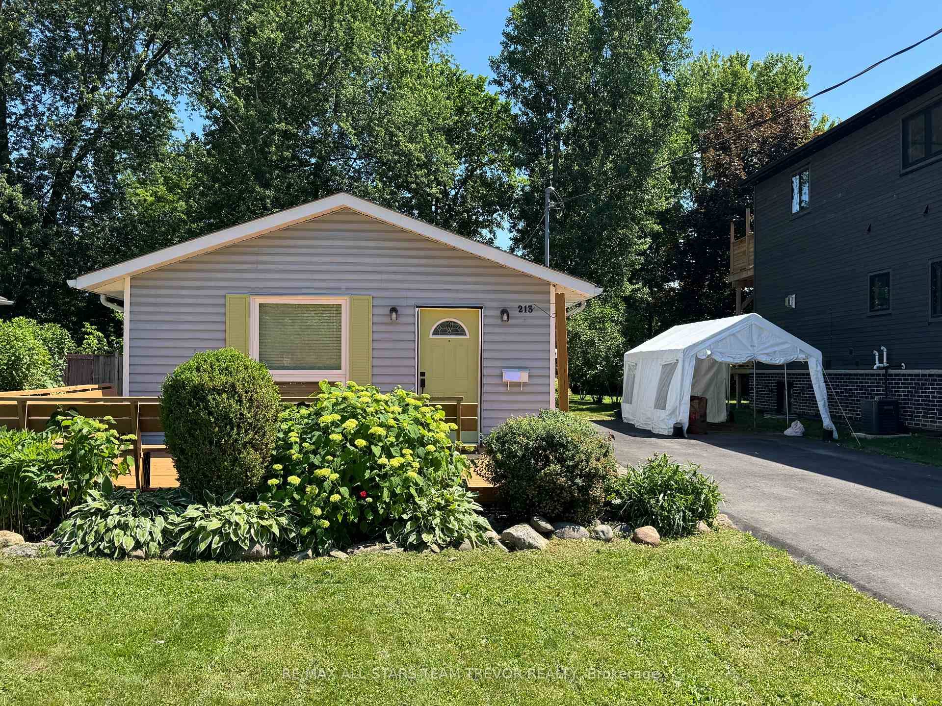 Tucked away on a peaceful street near the lake, yet just minutes from all the action in vibrant Keswick, this charming bungalow offers the perfect blend of convenience and tranquility.