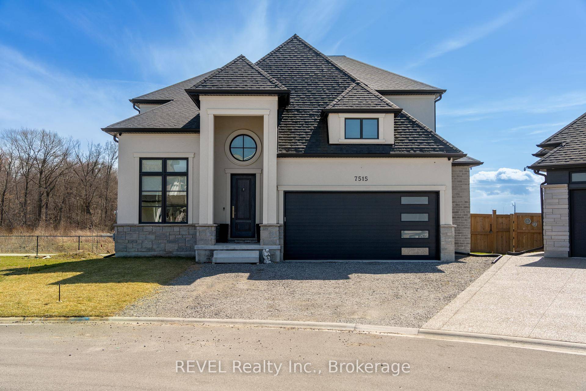 Luxury, style, and modern convenience define this stunning 2 storey stone amp ; stucco home, built in 2022 and backing onto a tranquil retention pond.