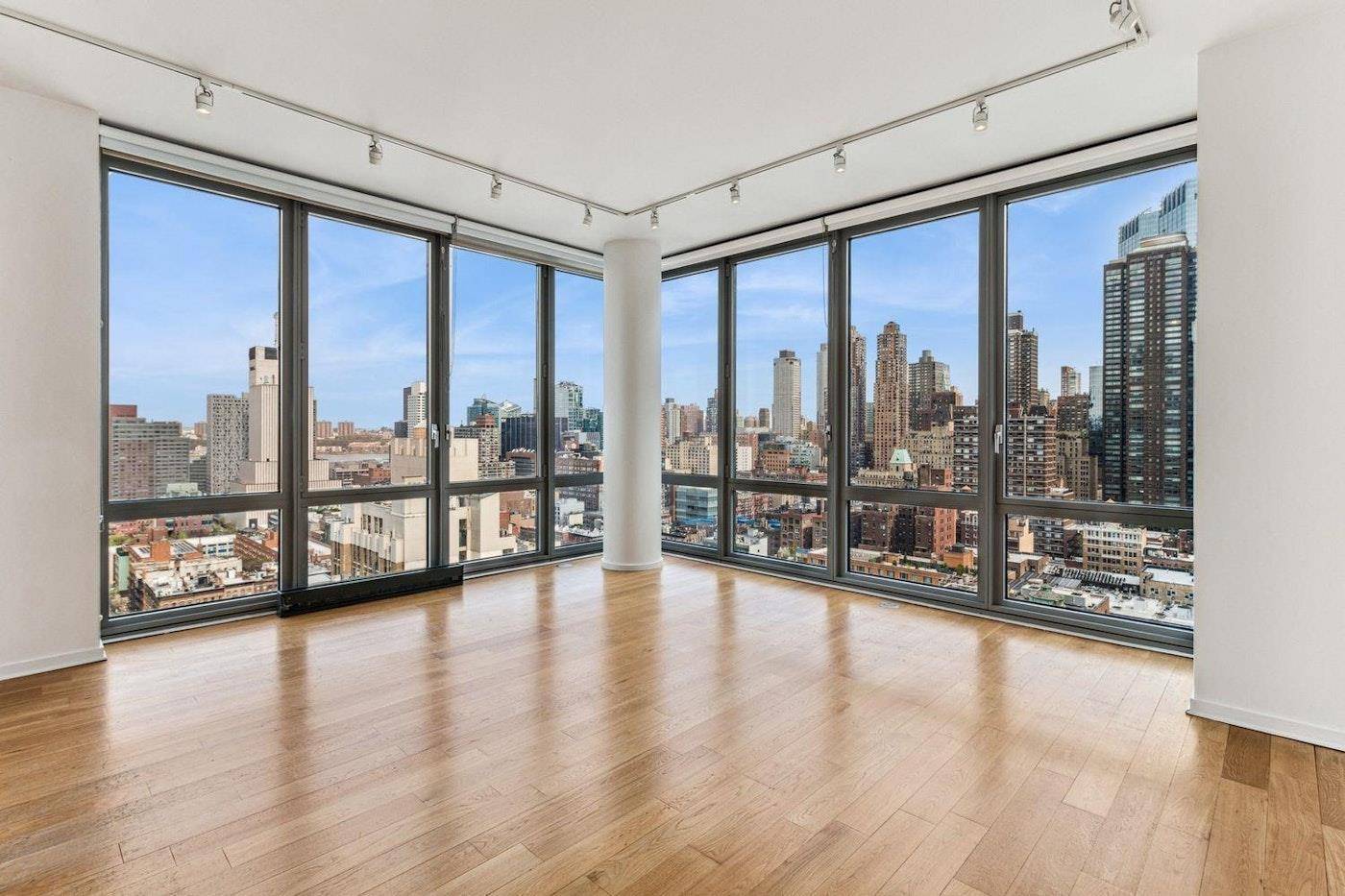 This stunning 1, 253 square foot residence features two bedrooms and two and a half bathrooms, boasting both North and West views that highlight the sweeping vistas of the Hudson ...
