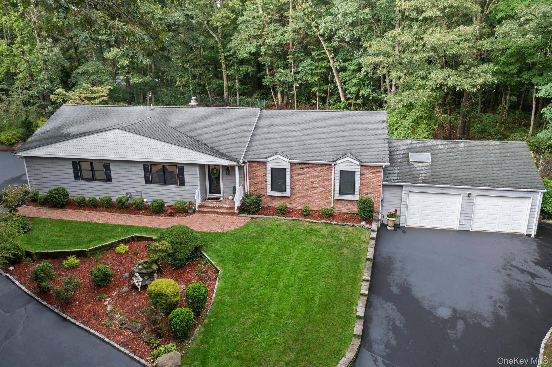 Completely renovated and move in ready, this modern ranch blends privacy, luxury, and convenience.