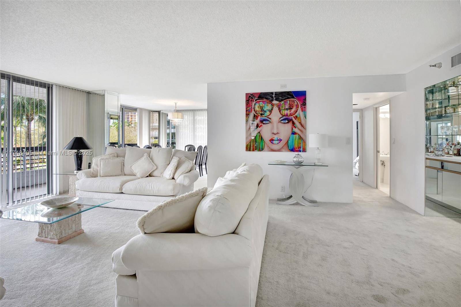 Fabulous corner unit in Mystic Pointe Tower 200 with water and pool views.