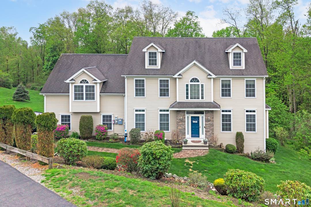 Beautiful 4 bedroom Colonial ideally situated on a peaceful cul de sac, set on a private 1.