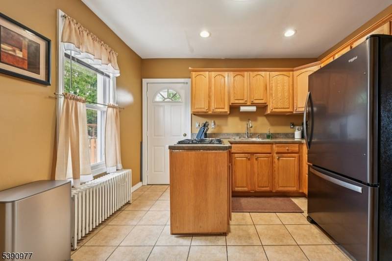 Make this beautifully maintained 3 bedroom, 1.