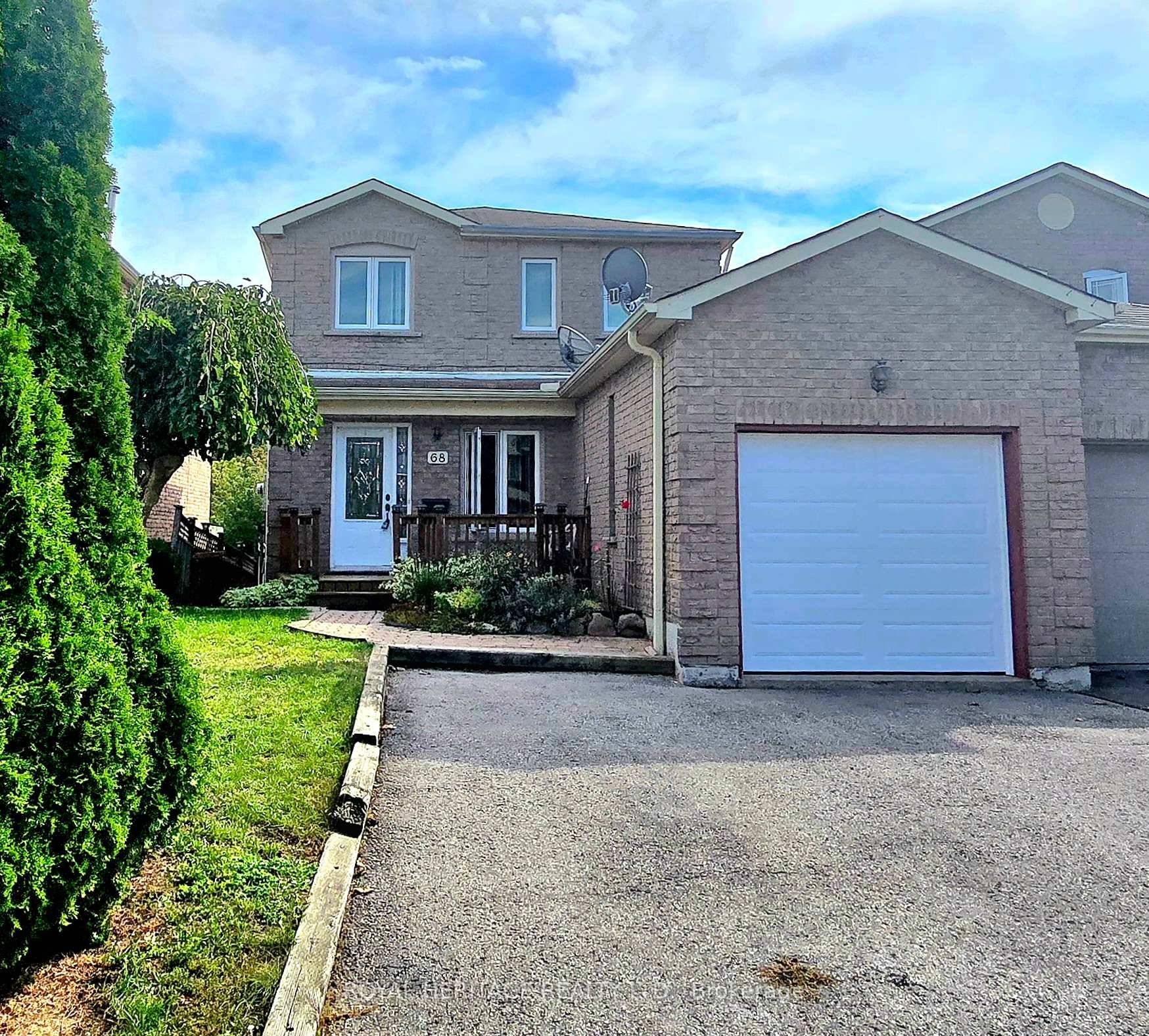 This all brick home has a walkout from the kitchen onto the composite deck leading down to the fenced yard abutting the treed ravine.