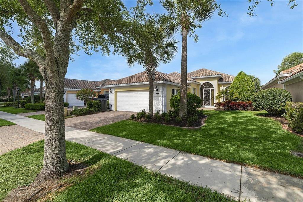Enjoy the screened lanai w heated pool private garden views in this 3BR 3BA loaded w upgrades !