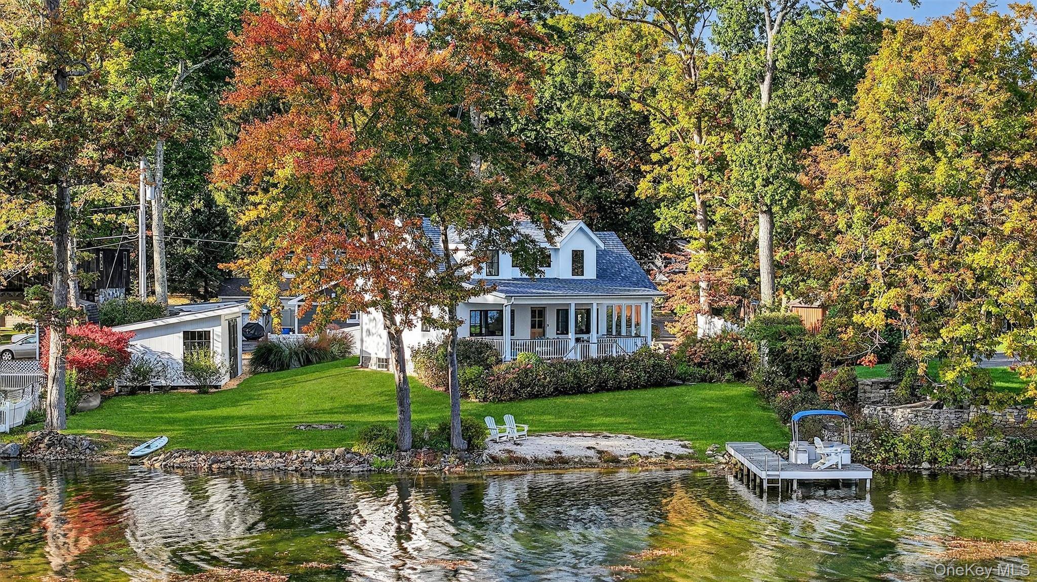 Nestled along the pristine shores of Sylvan Lake in Hopewell Junction, just over an hour North of NYC, this exquisite three bedroom, two bath, 1, 300 square foot lakefront home ...
