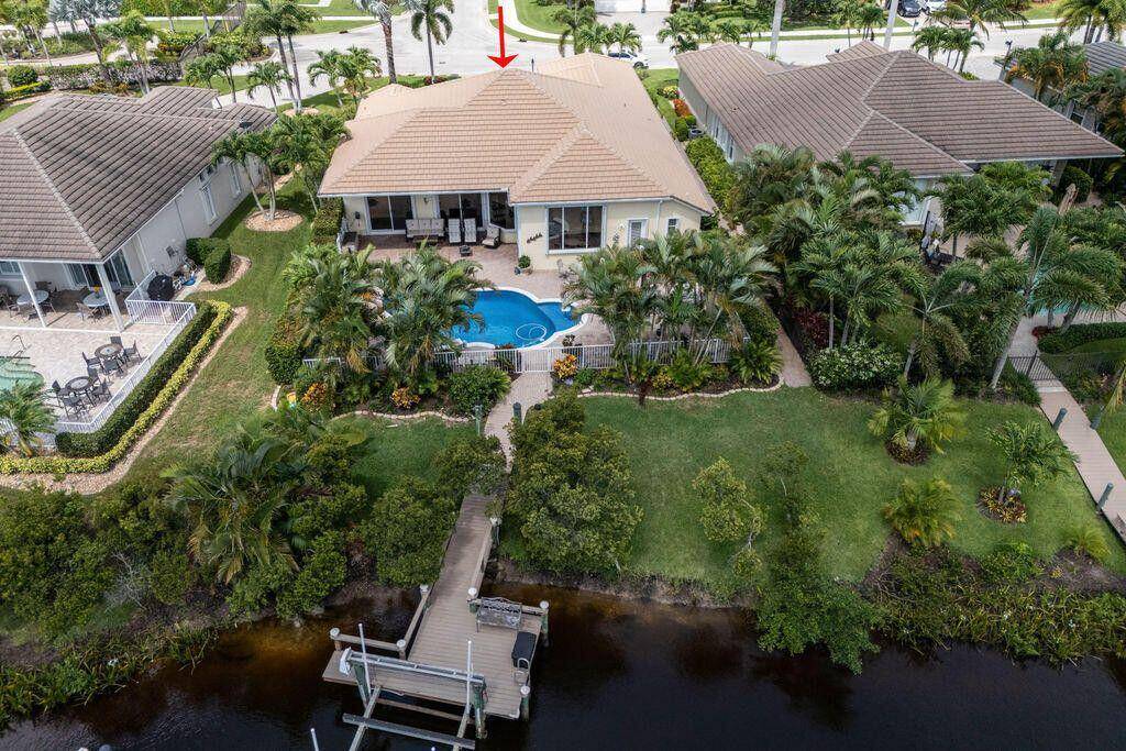 This stunning waterfront luxury home is a boater's paradise, located in the exclusive Lost River Plantation community.