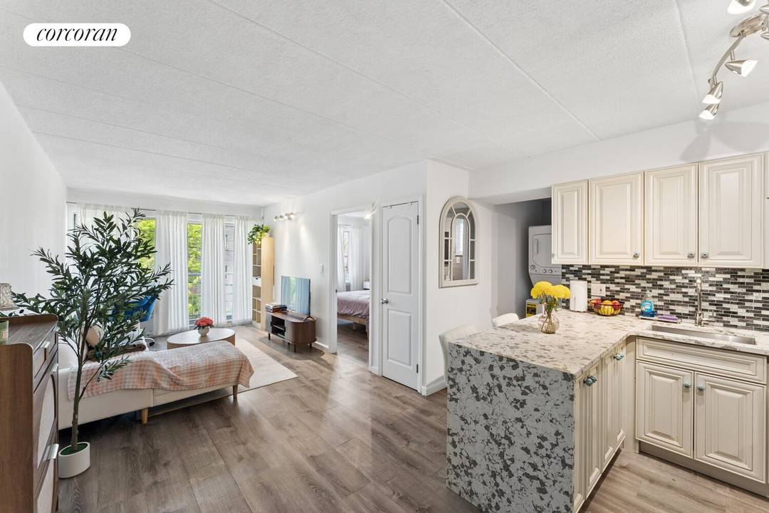 Income Producing Forest Hills Condo with Balcony amp ; Deeded Parking This meticulously renovated one bedroom condominium features an outdoor balcony and a deeded parking space.
