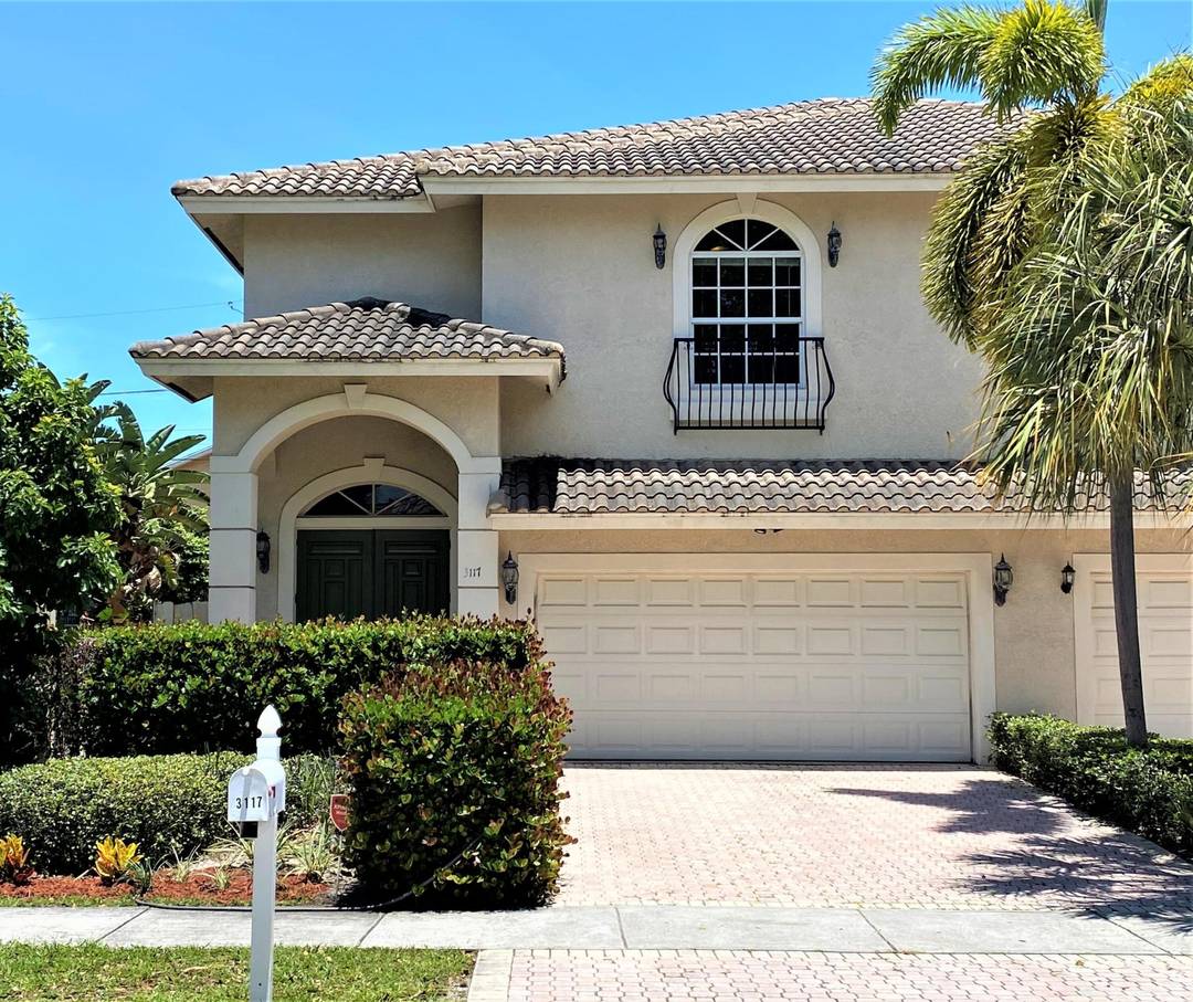Well appointed 2 story townhome in Delray's Tropic Isle offering the feel of a single family residence just minutes from the beach, Atlantic Ave, and premier shopping and dining.