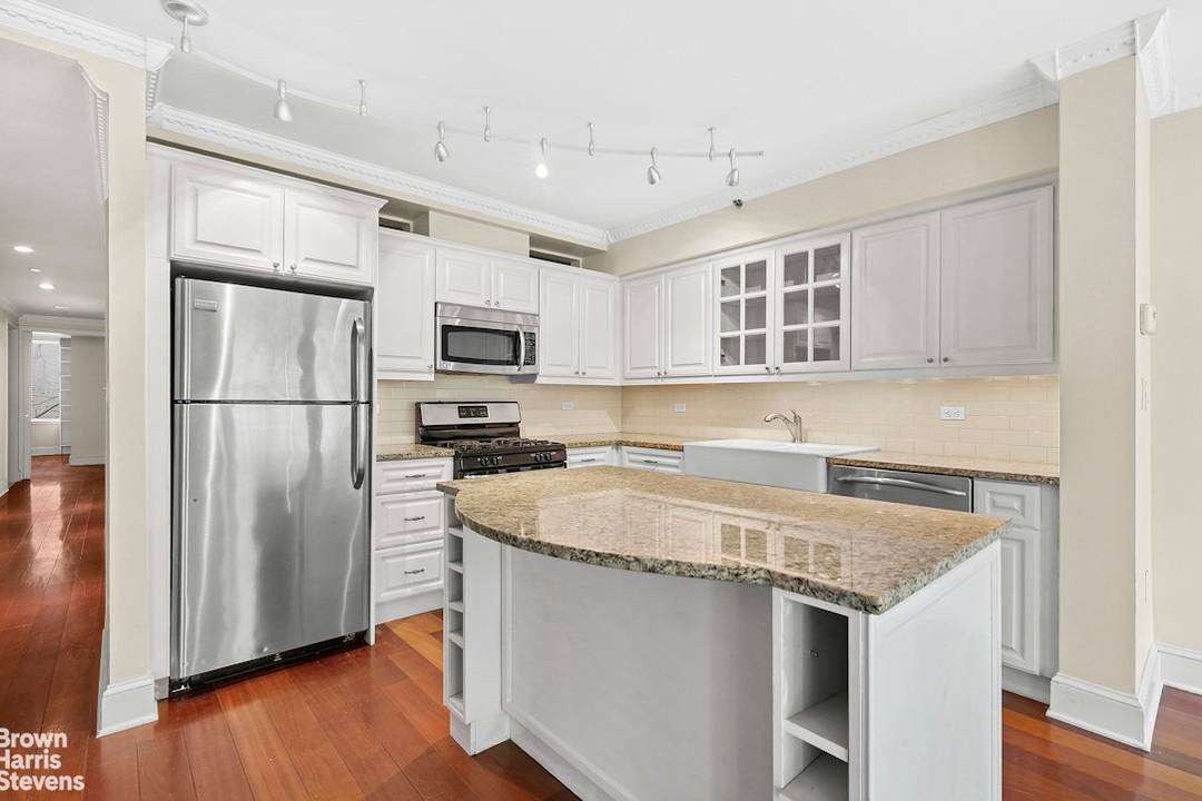Unobstructed Morningside Park views from a 28 foot wide wall of floor to ceiling windows !