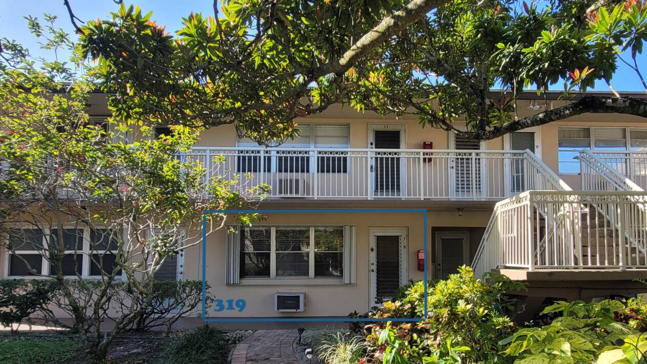 Cozy 1 1 condo with natural light, conveniently located on the first floor with a nearby laundry area.