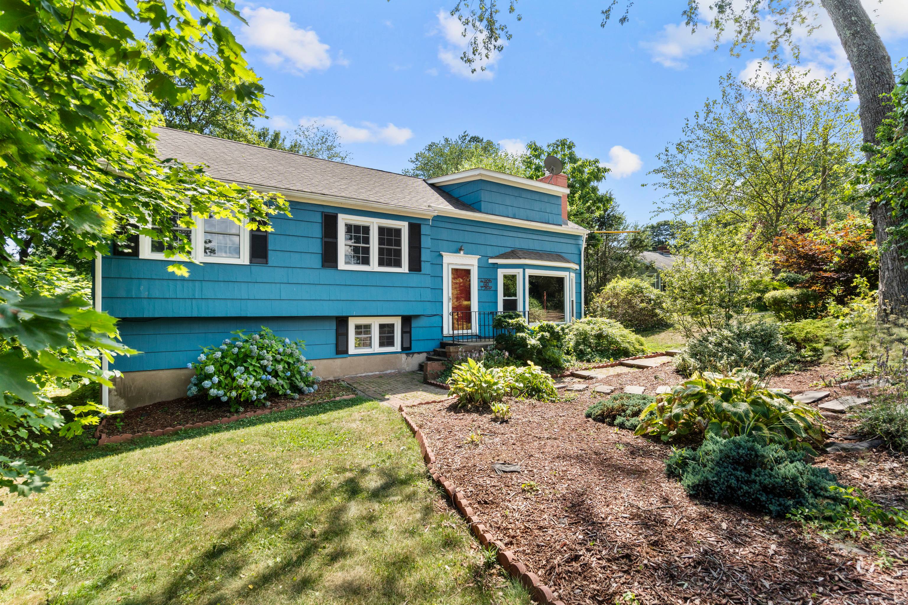 Tucked into Hamden's highly desirable Whitneyville neighborhood, this multi level residence delivers space, flexibility, and thoughtful updates across four finished levels.
