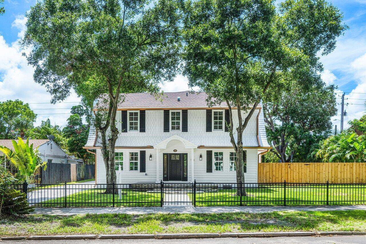 This stunning colonial home nestled in the historic district of West Palm Beach has been meticulously restored to its original splendor.