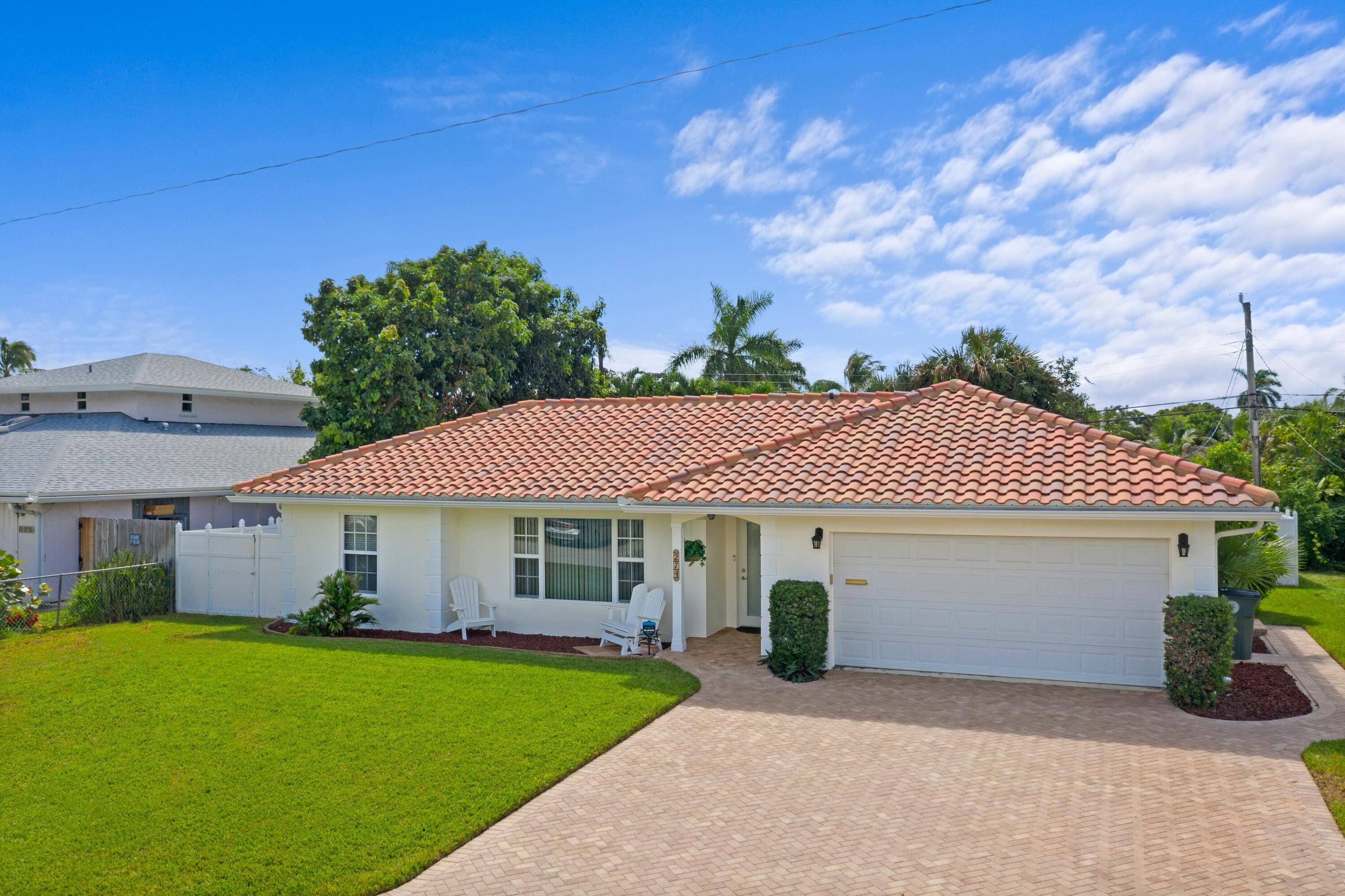 ABSOLUTELY GORGEOUS SINGLE FAMILY HOME PRIME EAST BOCA RATON LOCATION NO HOA FEES Immaculate Manicured Landscaping Screened Travertine Patio with Heated Free Form Pool New White Vinyl Fence All Hurricane ...