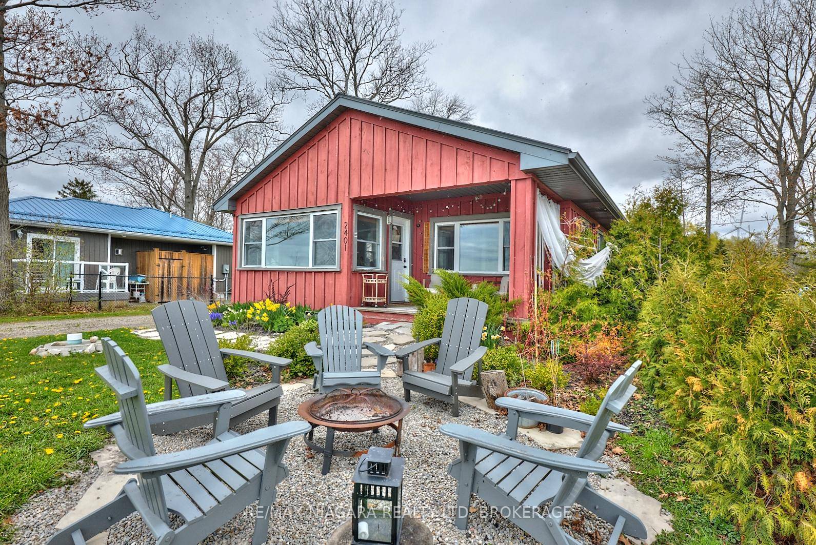 Charming 4 Season Lakefront Home on Acre Lot with Private Beach Access.