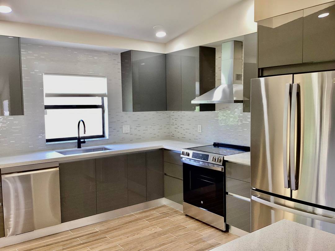 TOTALLY REMODELED 3 BED 2 BATH 1 CAR GARAGE HOME IN CHARMING ARBOR WOOD VILLAS COMMUNITY.