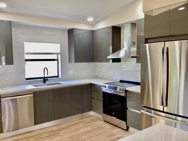 TOTALLY REMODELED 3 BED 2 BATH 1 CAR GARAGE HOME IN CHARMING ARBOR WOOD VILLAS COMMUNITY.