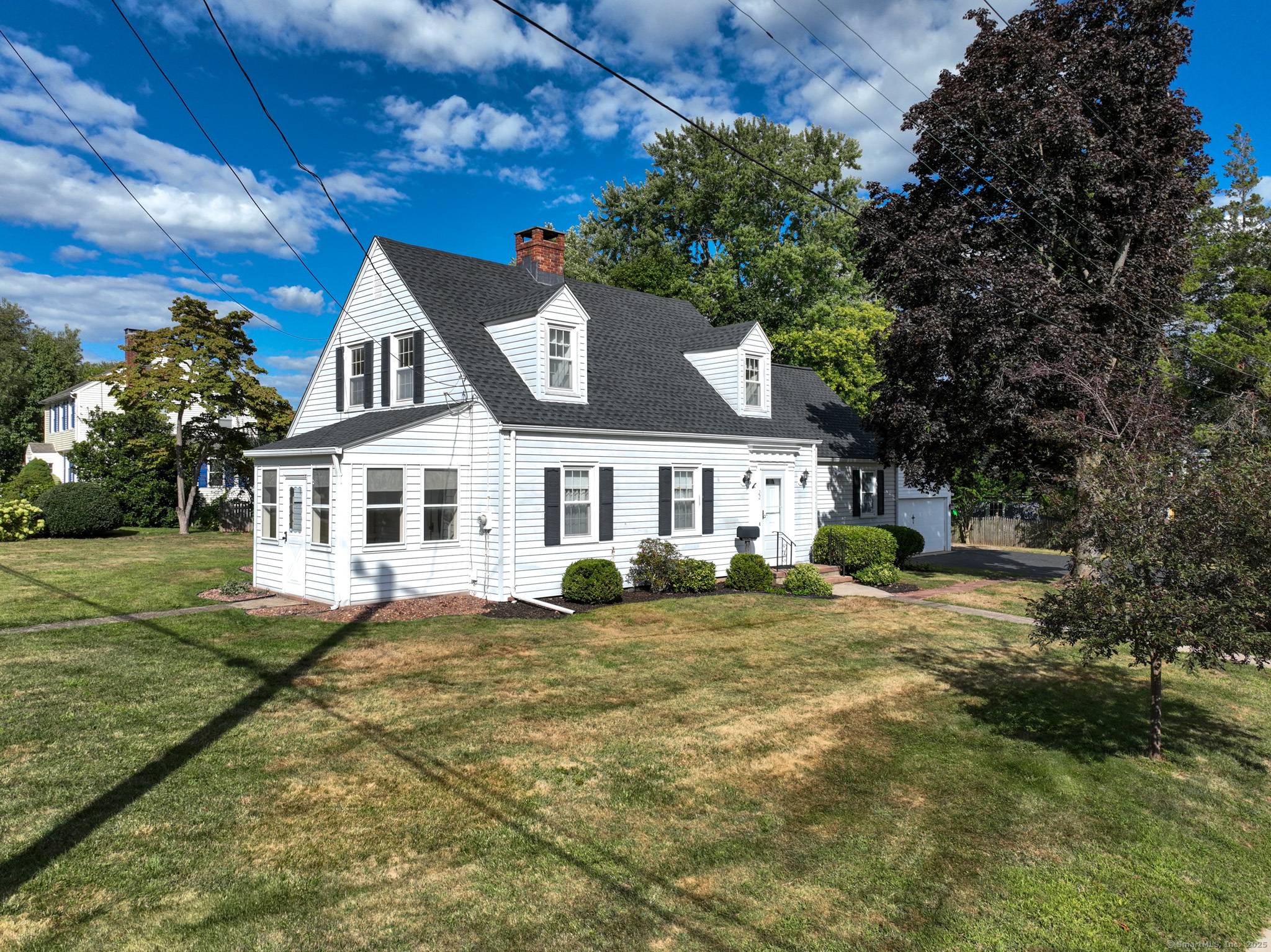 This charming home offers a spacious living room with a cozy gas fireplace, perfect for relaxing evenings.