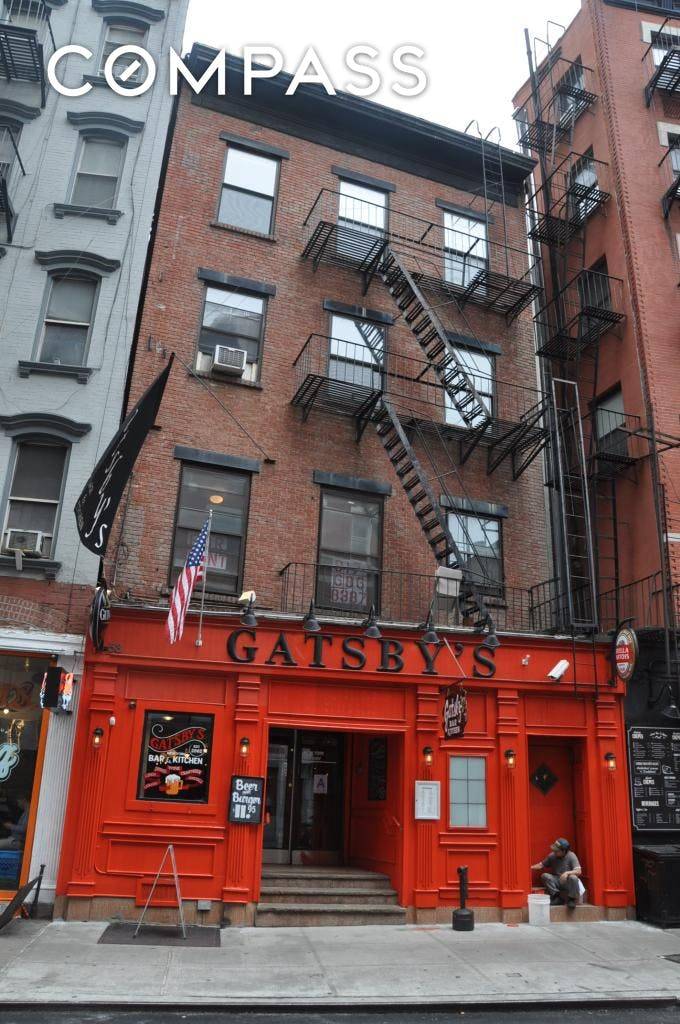 53 SPRING STREET is a 6 unit mixed use building, comprised of 5 residential units and one commercial space.