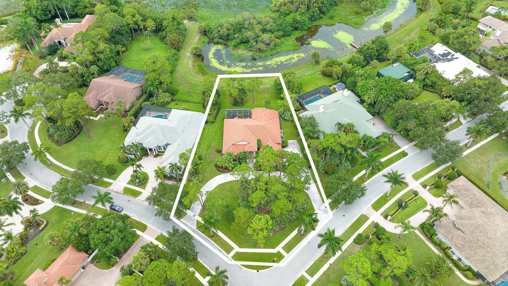 Magnificent,. 63 ACRE, pie shaped, corner lot overlooking pristine nature preserve and offering incomparable PRIVACY within a world class country club setting.