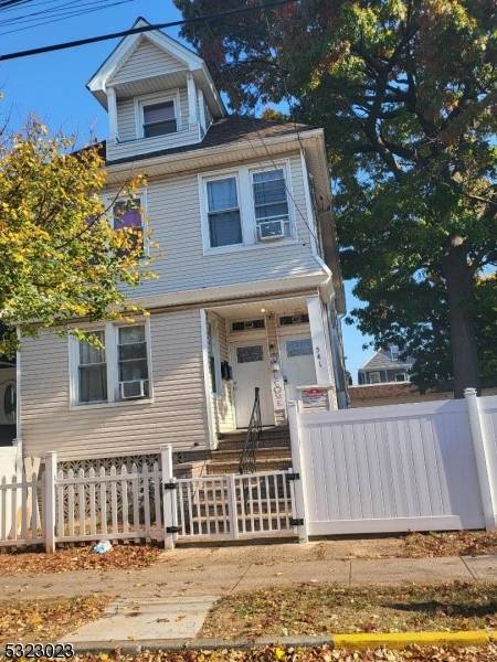 TWO FAMILY.. THREE DETACHED GARAGE SPACES AND EXTRA PARKING.