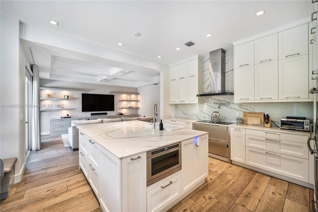 Rarely available two story pool home with garage in gated Country Club Estates, Aventura's premier enclave along the Turnberry golf course and Aventura Circle.