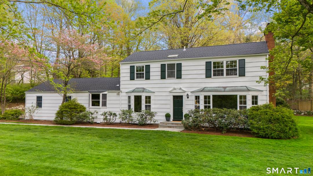 Classic Colonial Split with beautiful water views of Horseshoe Pond, ideally set in the heart of Wilton with the rare convenience of walking to town.