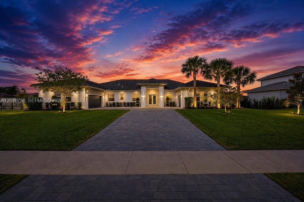 Experience elevated estate living in this exceptional Sierra Ranches residence, nestled within one of Davie s most prestigious gated communities.