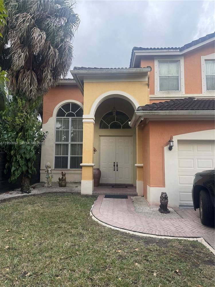 Spacious lakefront home located in Melrose Landing, a gated community with security, private roads, and a beautiful central lake.