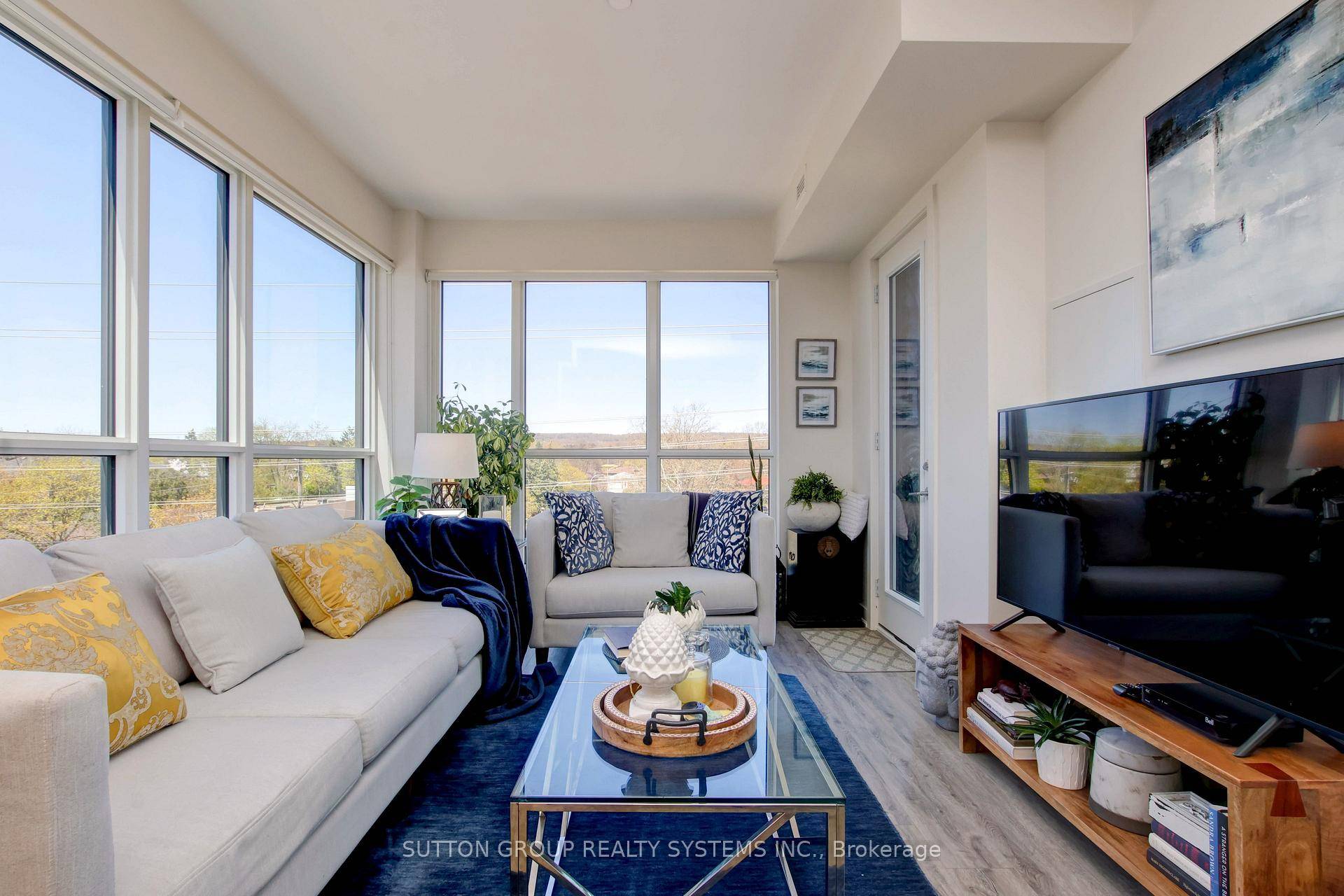 Stunning light filled furnished corner unit with floor to ceiling windows and unobstructed views of the escarpment.