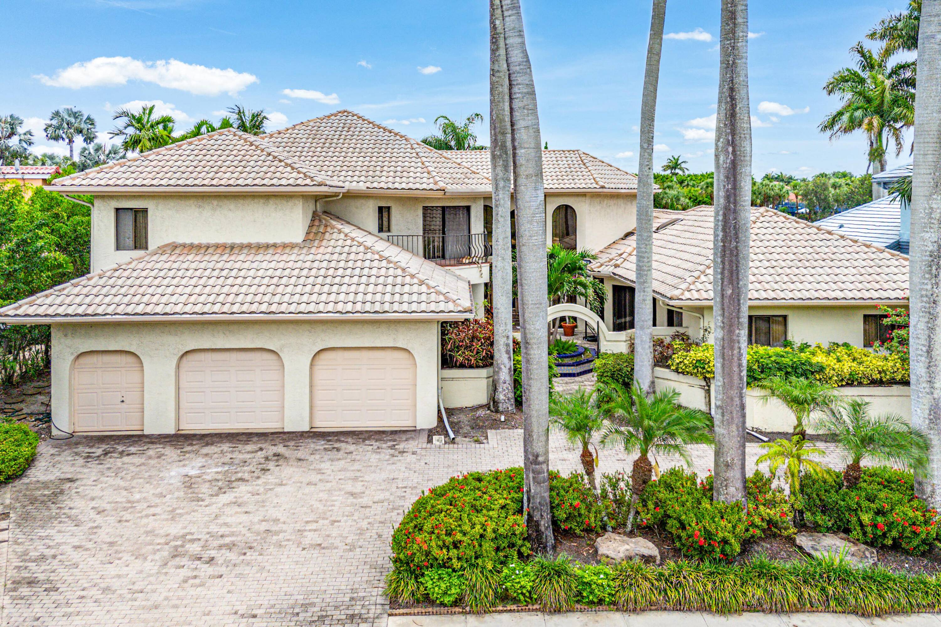 Enter through stately iron gates into a tranquil courtyard with a beautiful fountain.