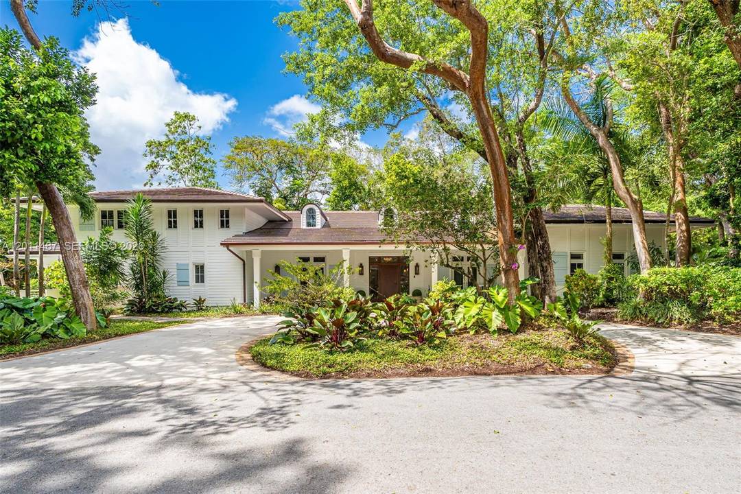 Tucked away in the serene guard gated enclave of Hammock Lakes, this masterfully enhanced 5 bedroom, 4 bathroom, 2 half bathroom residence showcases thoughtful upgrades designed for timeless comfort.