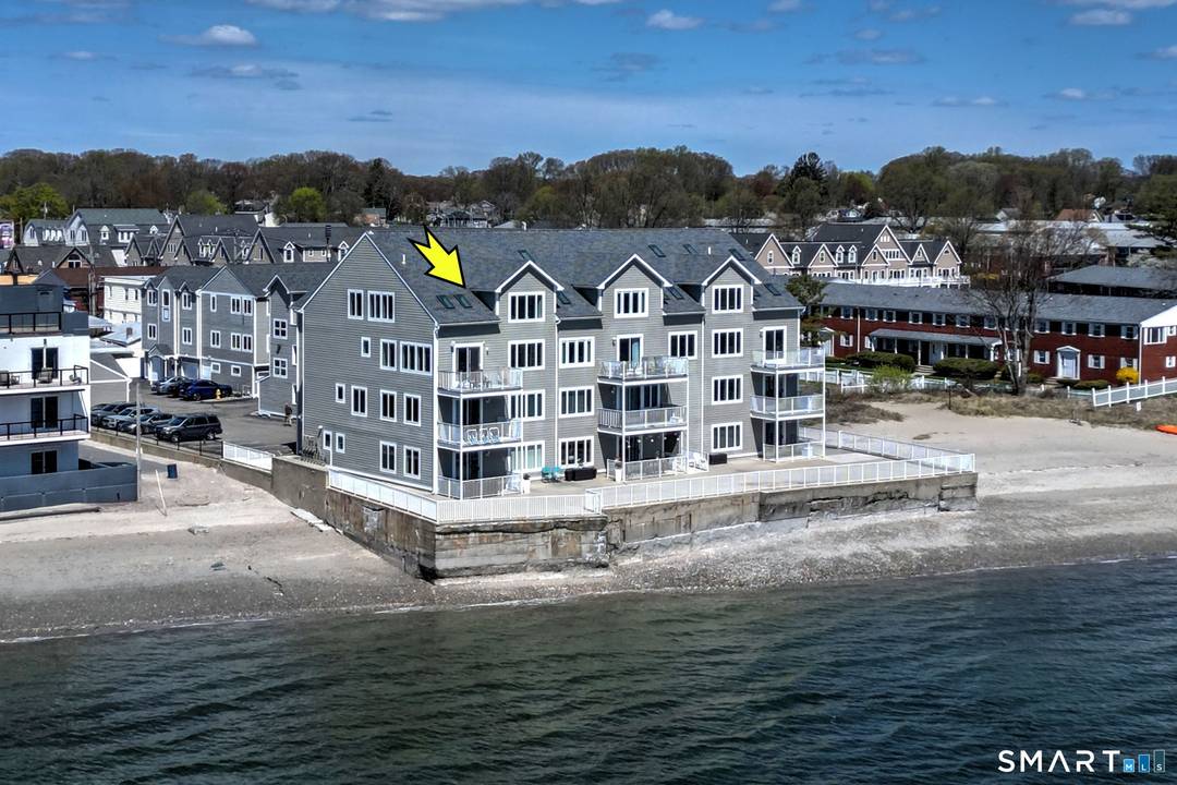 DIRECT WATERFRONT CONDO Private sandy beach and expansive waterside patio.